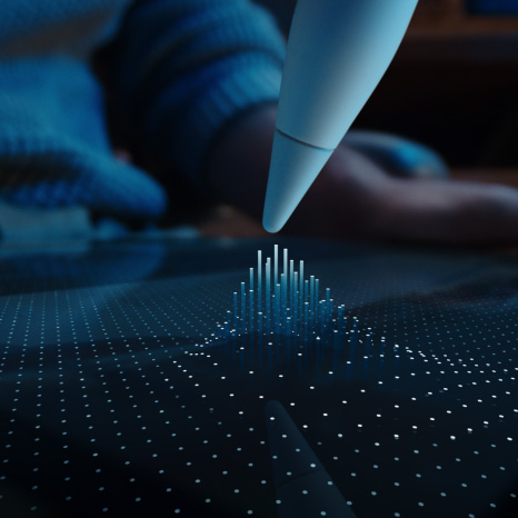 Apple Pencil Pro i hvid, spidsen af enheden svæver over iPad-skærmen, som viser et gitter af prikker, hvor nogle rejser sig i søjler op mod spidsen af Apple Pencil Pro